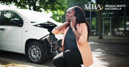 woman beside a car wreck