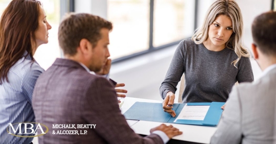 family talking to a lawyer